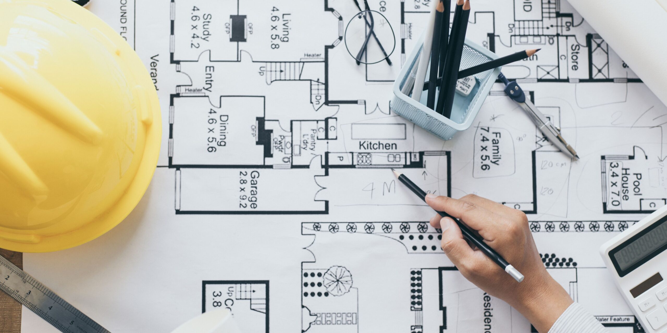 Builder marking up home modification plans