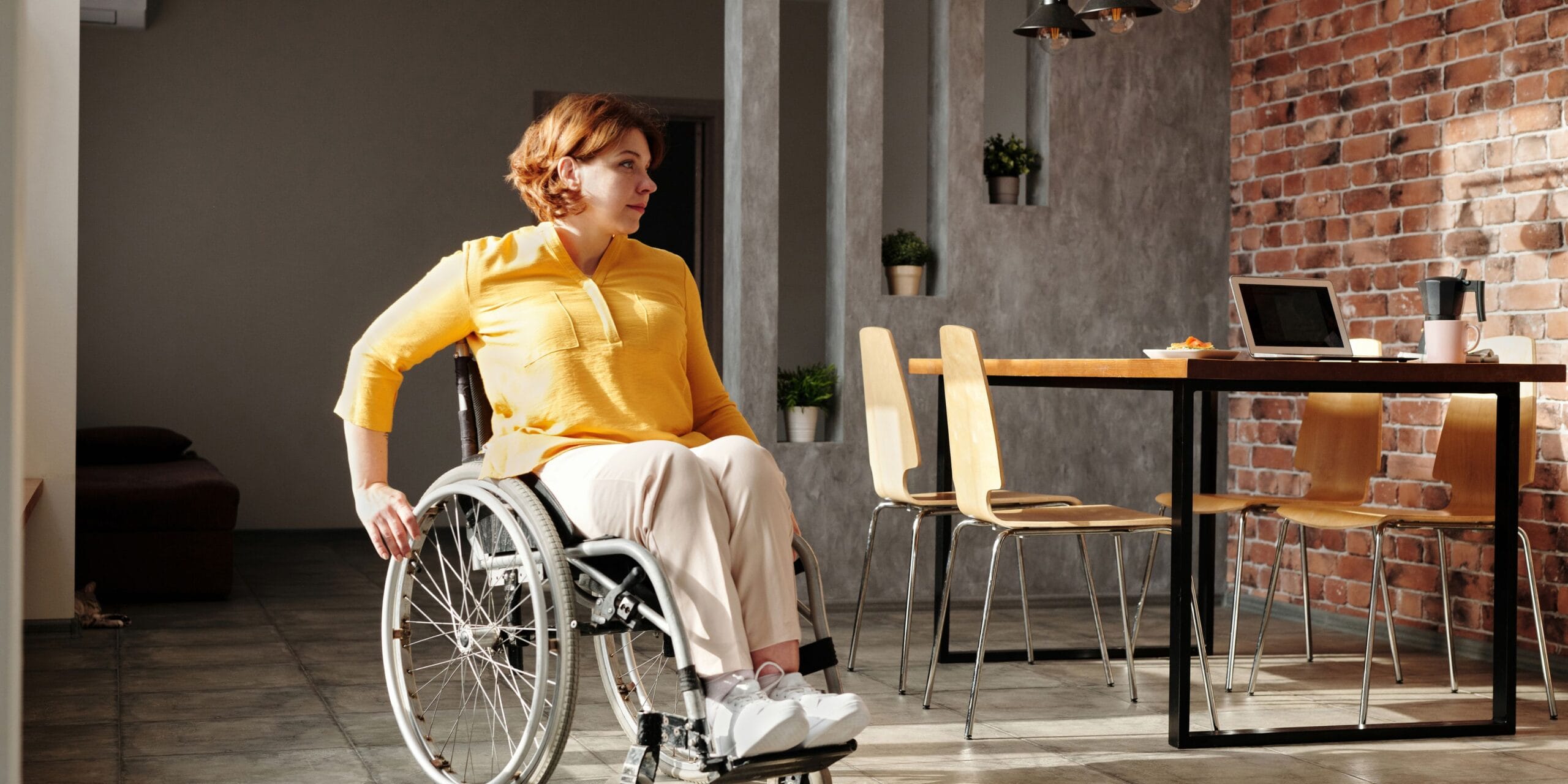 Woman in a wheelchair at home