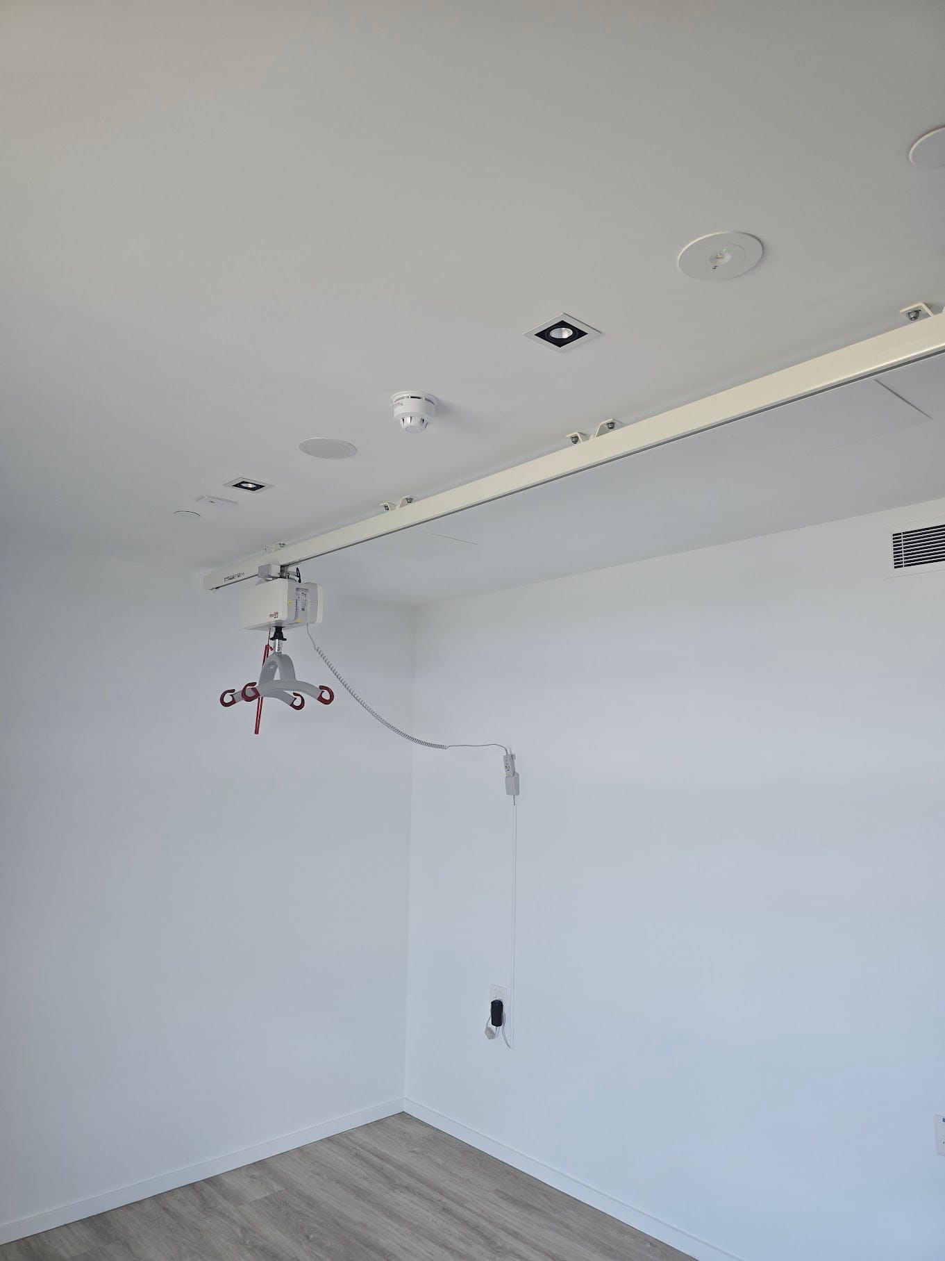 Ceiling hoist track installed in a room